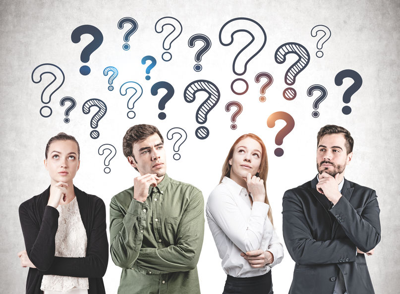 two men and two women posing in a way that shows they are thinking, with cartoon question marks above them in the background